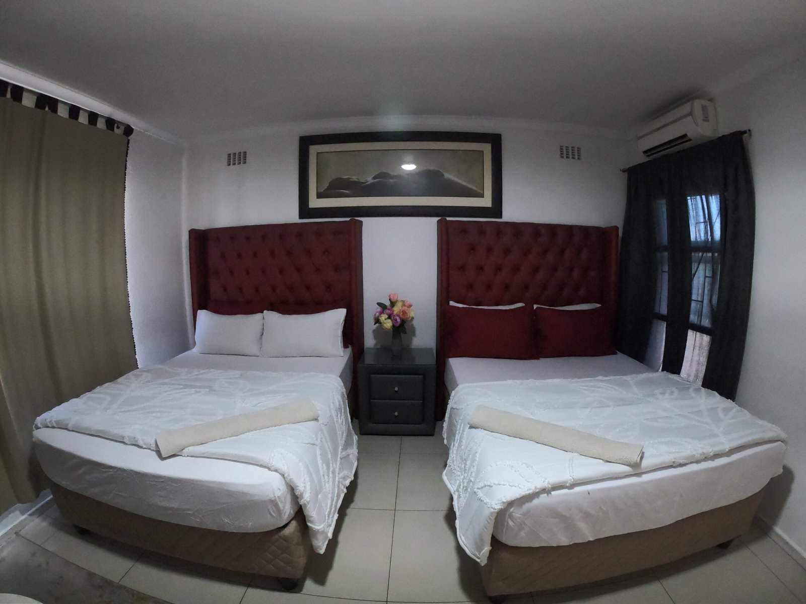 Spacious double room at Galaxy Sleep N Go in Goodwood, Cape Town, with modern furnishings and natural light view inside
